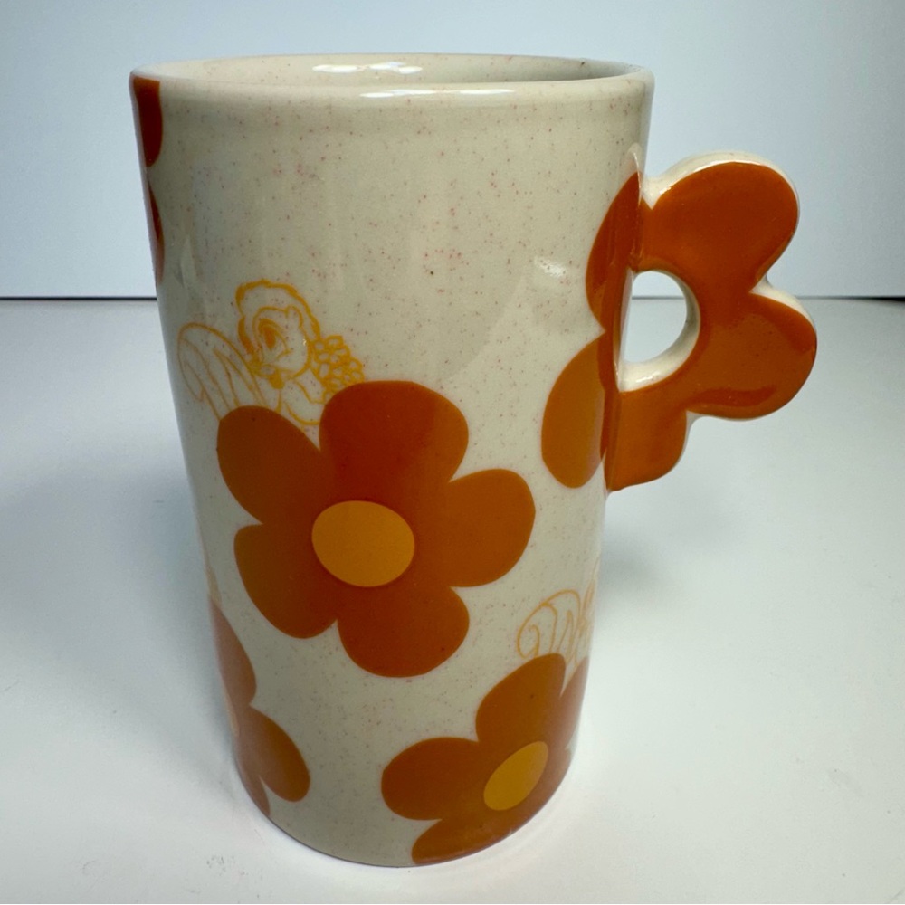 NWT. Flower mug featuring adorable sketches of Bambi's skunk pal Flower